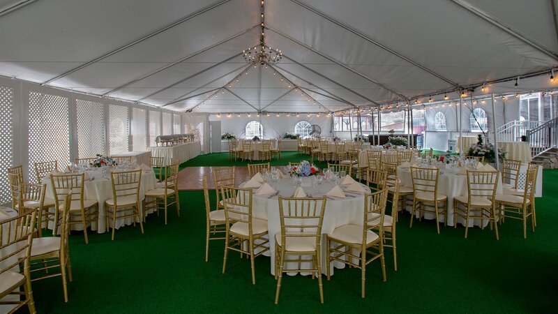 Outdoor banquet area with set tables